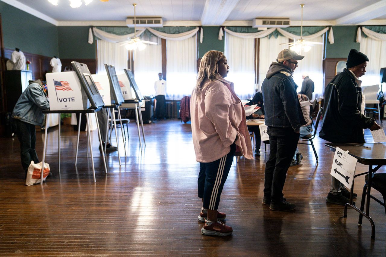 Detroit residents wait in line to vote on Tuesday.