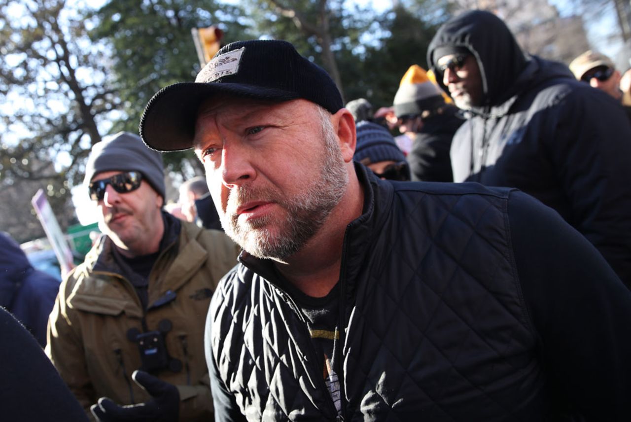 Radio show host Alex Jones joins thousands of gun rights advocates attending a rally organized by The Virginia Citizens Defense League on Capitol Square near the state capitol building January 20 in Richmond, Virginia. 