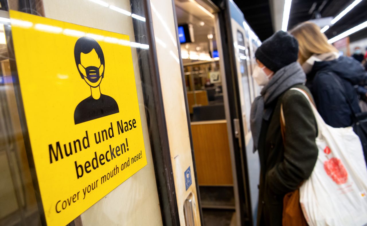 Two women wearing FFP2 masks board a train in Bavaria, on January 12, 2021. 