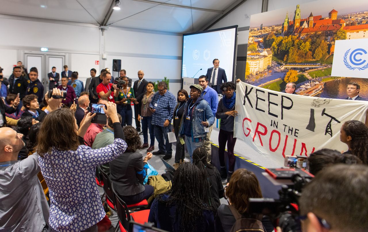 Demonstrators disturb the speech of P. W. Griffith, advisor to US President Trump, at the Department of Energy at COP24 on December 10.