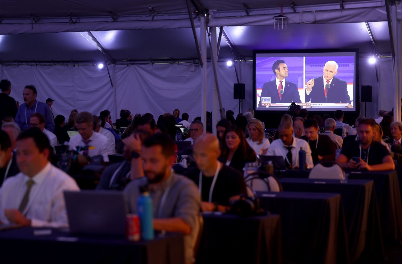 Members of the media work as Republican presidential candidates Vivek Ramaswamy and Mike Pence participate in the FOX Business Republican Primary Debate. Ramaswamy had more than 12 minutes of speaking time in Wednesday's debate.