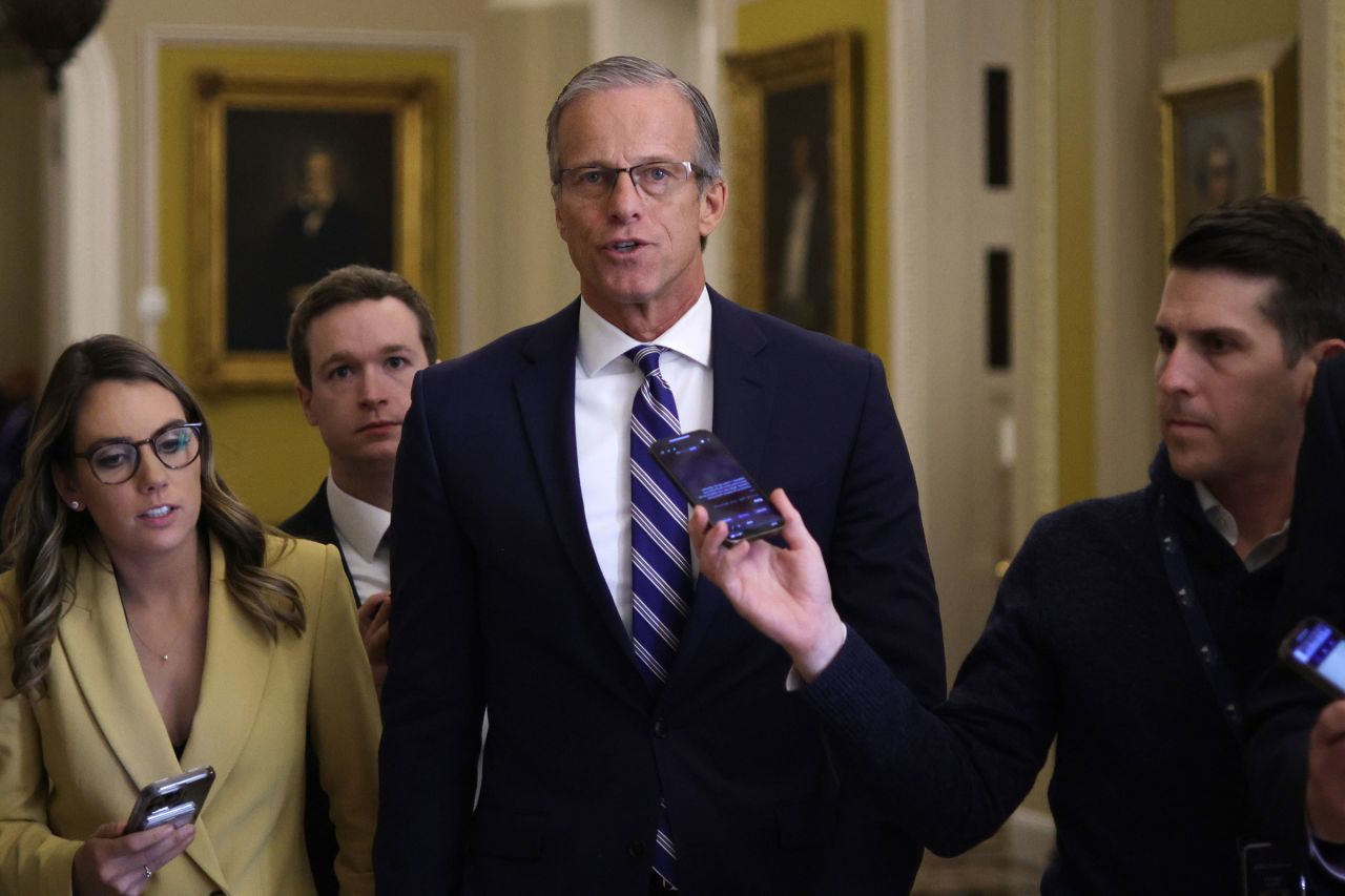 US Senate Minority Whip Sen. John Thune talks to members of the press as he walks in a hallway at the US Capitol on February 29, in Washington, DC. 