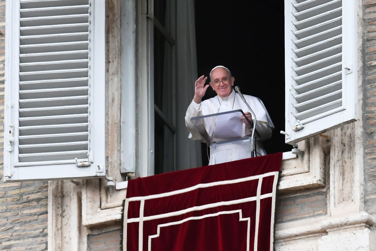 Pope Francis blesses delivers his message from the window of the apostolic palace overlooking St. Peter's square during the weekly Angelus prayer on Sunday.