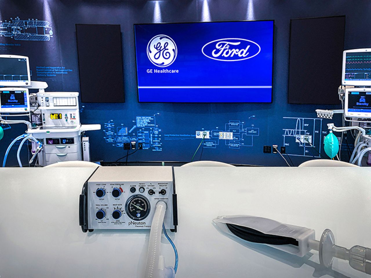 A Model A-E ventilator, left, and a simple test lung. The ventilator uses a design that operates on air pressure without the need for electricity, addressing the needs of most COVID-19 patients. Its production can be quickly scaled to help meet growing demand in the U.S.?