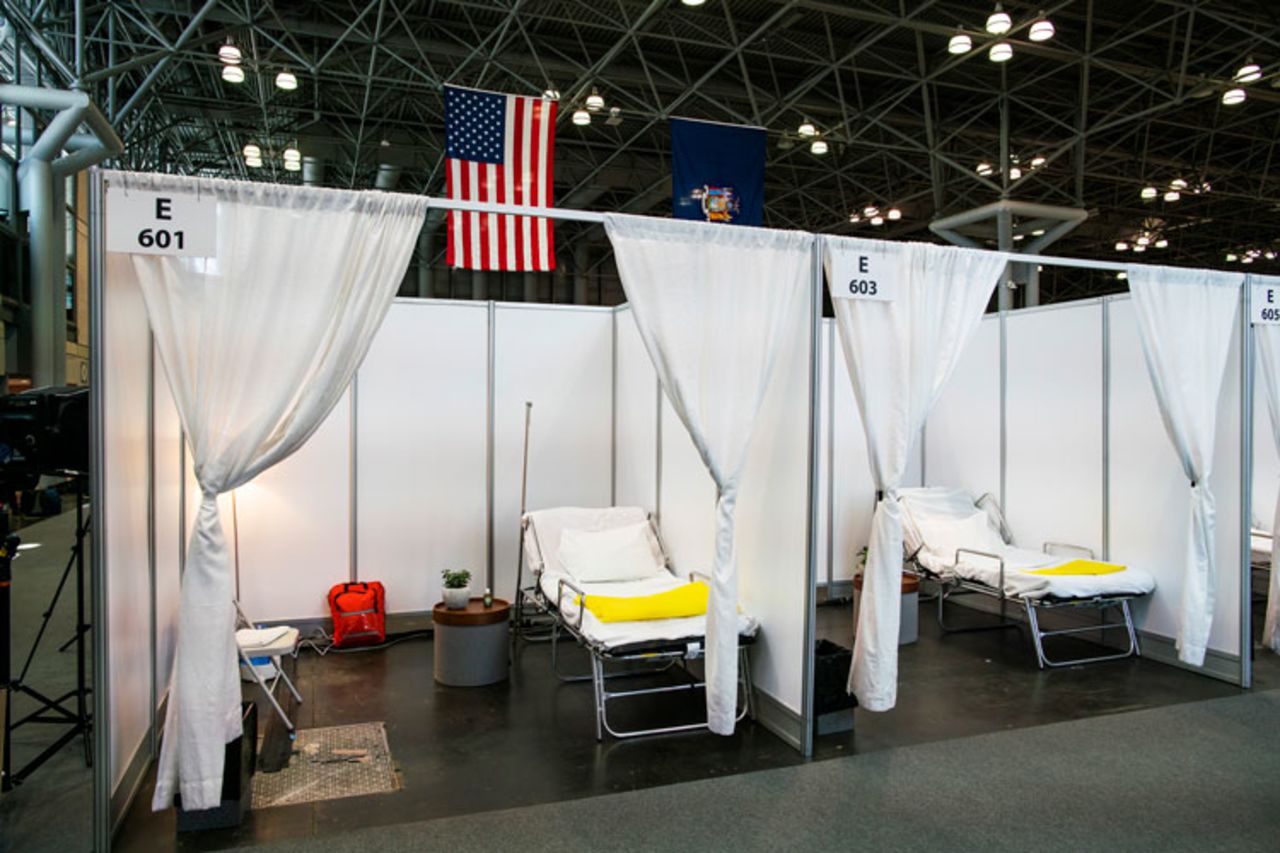 Hospital bed booths are set up at the Jacob K. Javits Convention Center which is being turned into a hospital to help fight coronavirus cases on March 27 in New York City. 