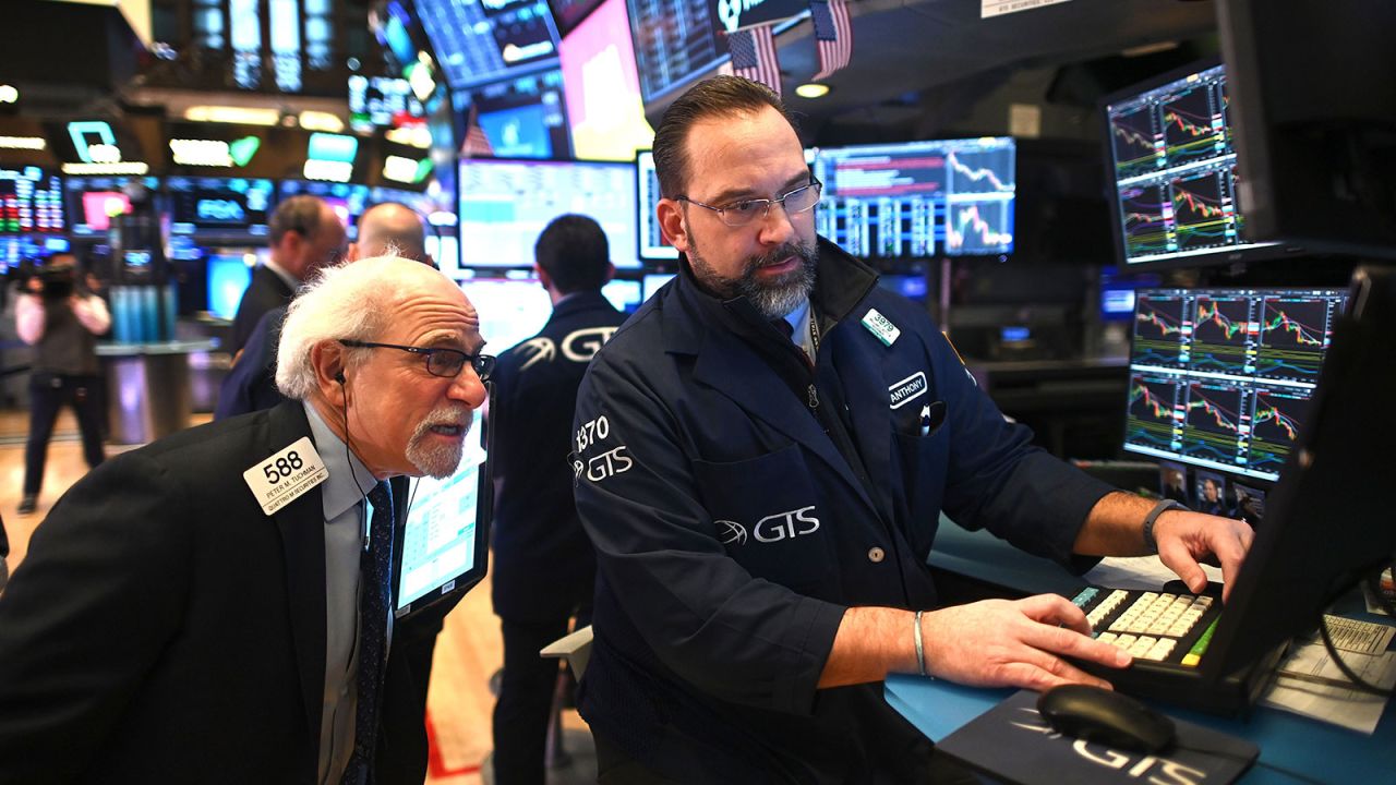 Traders work during the opening bell at the New York Stock Exchange on February 27.