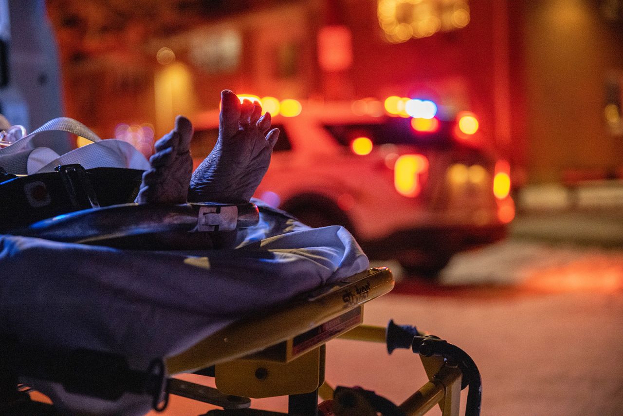 A woman, 70, with possible Covid-19 symptoms and pre-existing conditions is rushed to a hospital by Empress EMS on December 17, in Yonkers, New York.