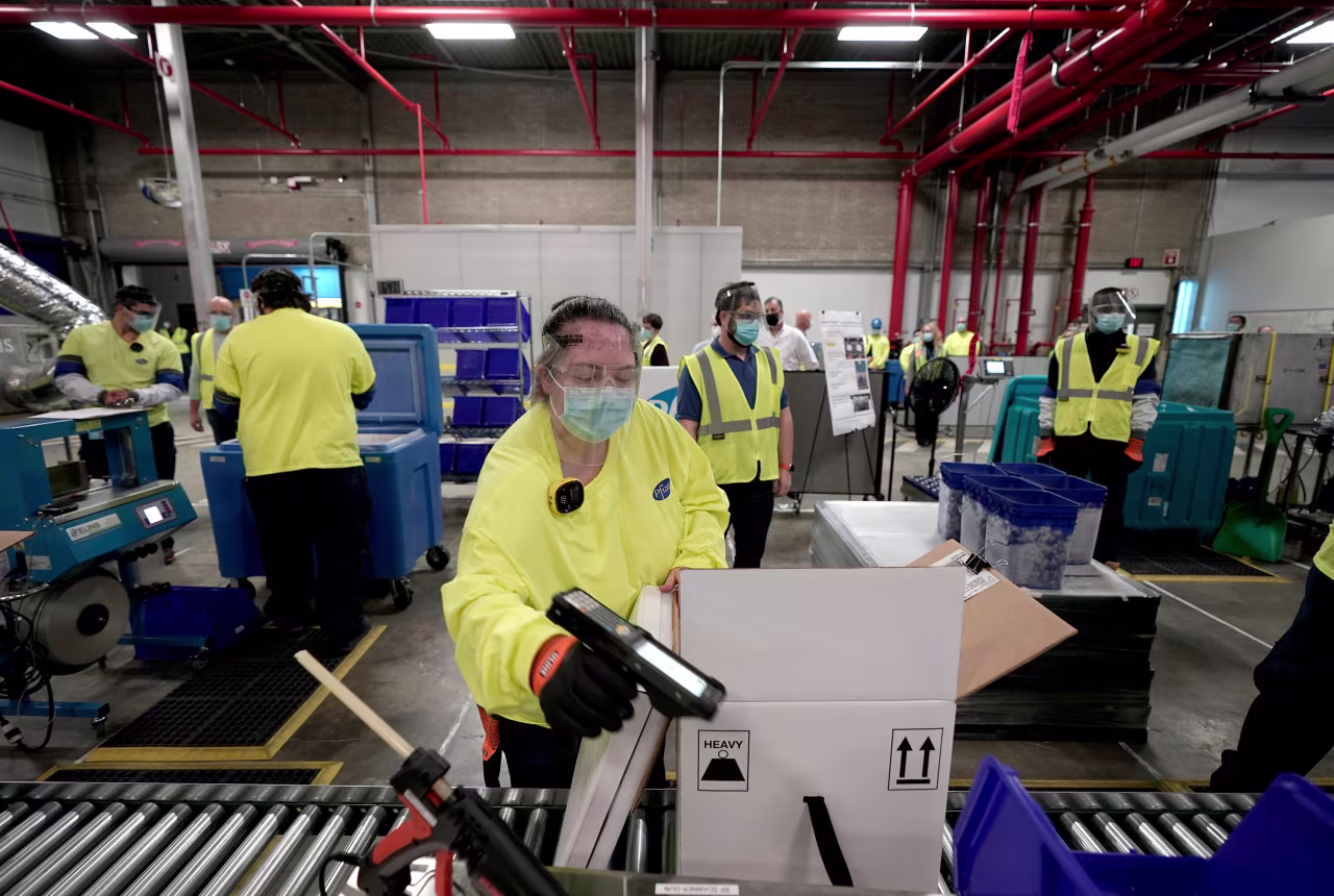 Boxes containing the Pfizer-BioNTech Covid-19 vaccine are prepared to be shipped at the Pfizer facility in Kalamazoo, Michigan, on December 13.