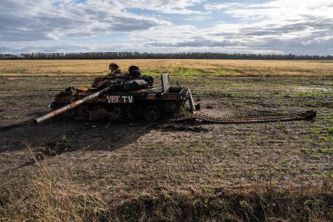 A Russian tank lies destroyed in a field on October 13, near Izyum, Ukraine.