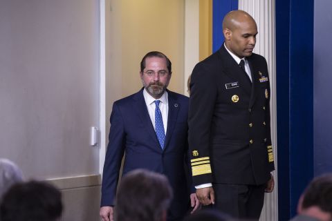 From left, Health and Human Services Secretary Alex Azar and US Surgeon General Jerome Adams arrive at a coronavirus task force briefing on March 9.
