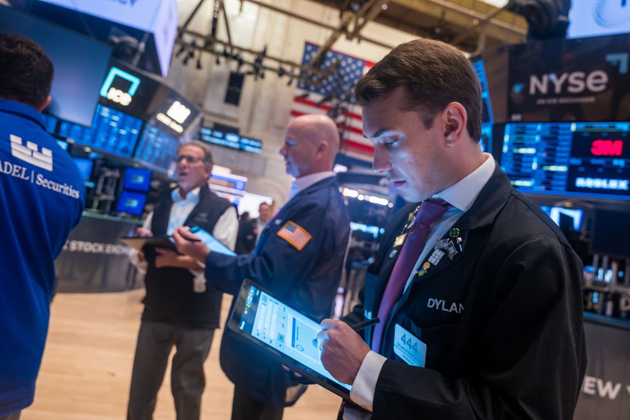 Traders work on the floor of the New York Stock Exchange on August 5.