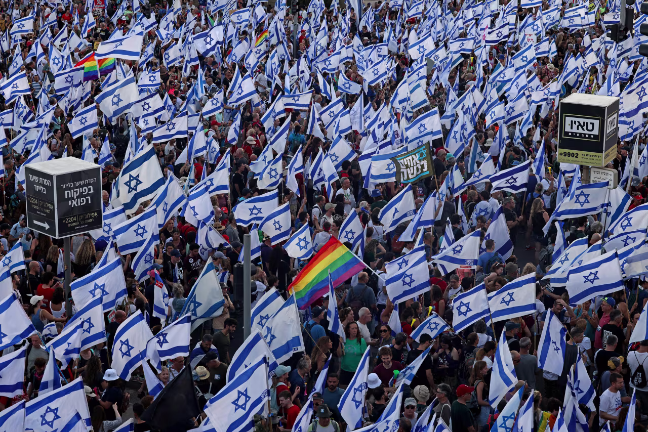 Protesters gather with national and rainbow flags outside the Israeli parliament and the supreme court in Jerusalem, Israel, on July 23.