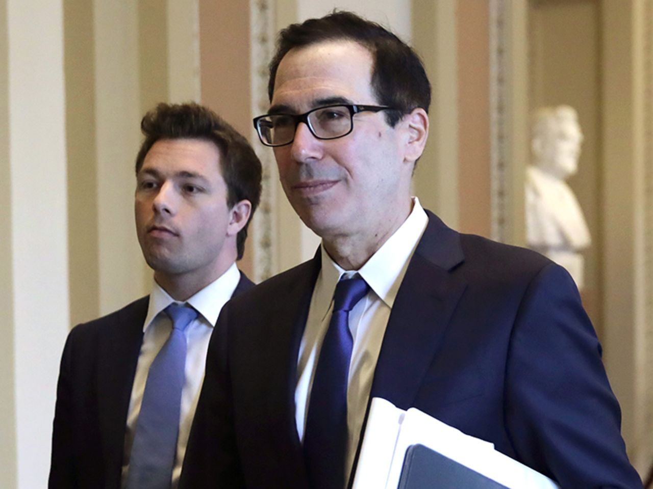 U.S. Secretary of the Treasury Steven Mnuchin walks in a hallway at the U.S. Capitol Monday, March 23.