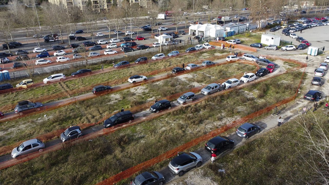 Cars line up at a rapid swab testing drive-through site in Rome on Thursday, Dec. 30, 2021. 