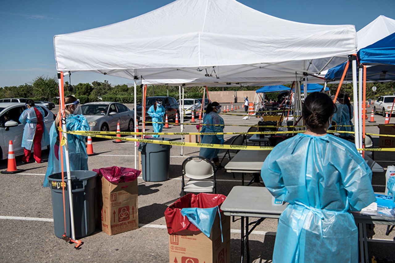 Nurses conduct coronavirus testing at a newly opened drive-thru site at El Paso Community College Valle Verde campus on July 21, in El Paso, Texas. 