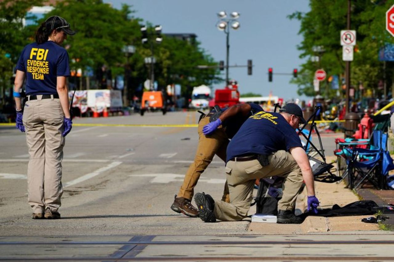 FBI agents investigate at the scene of the shooting on Tuesday.