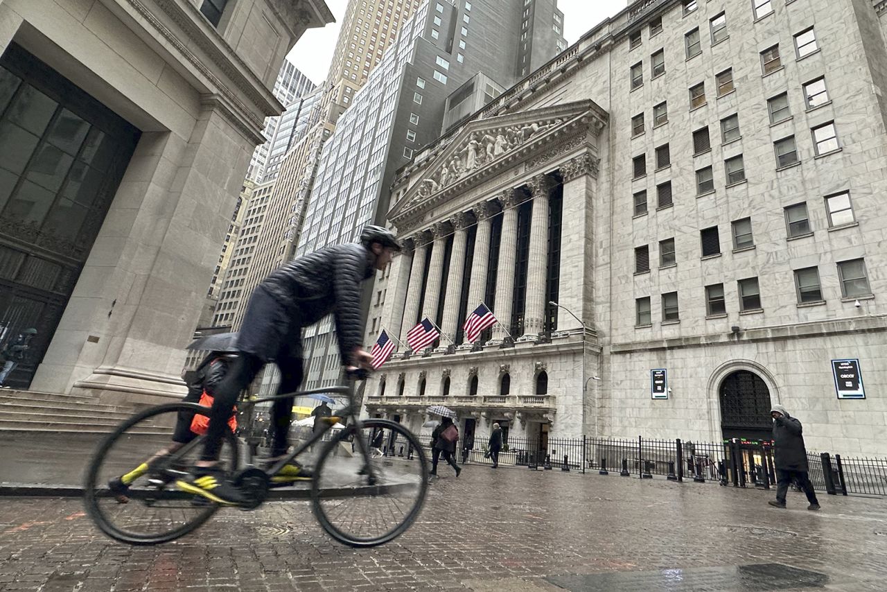 A bicyclist passes the New York Stock Exchange on March 5.