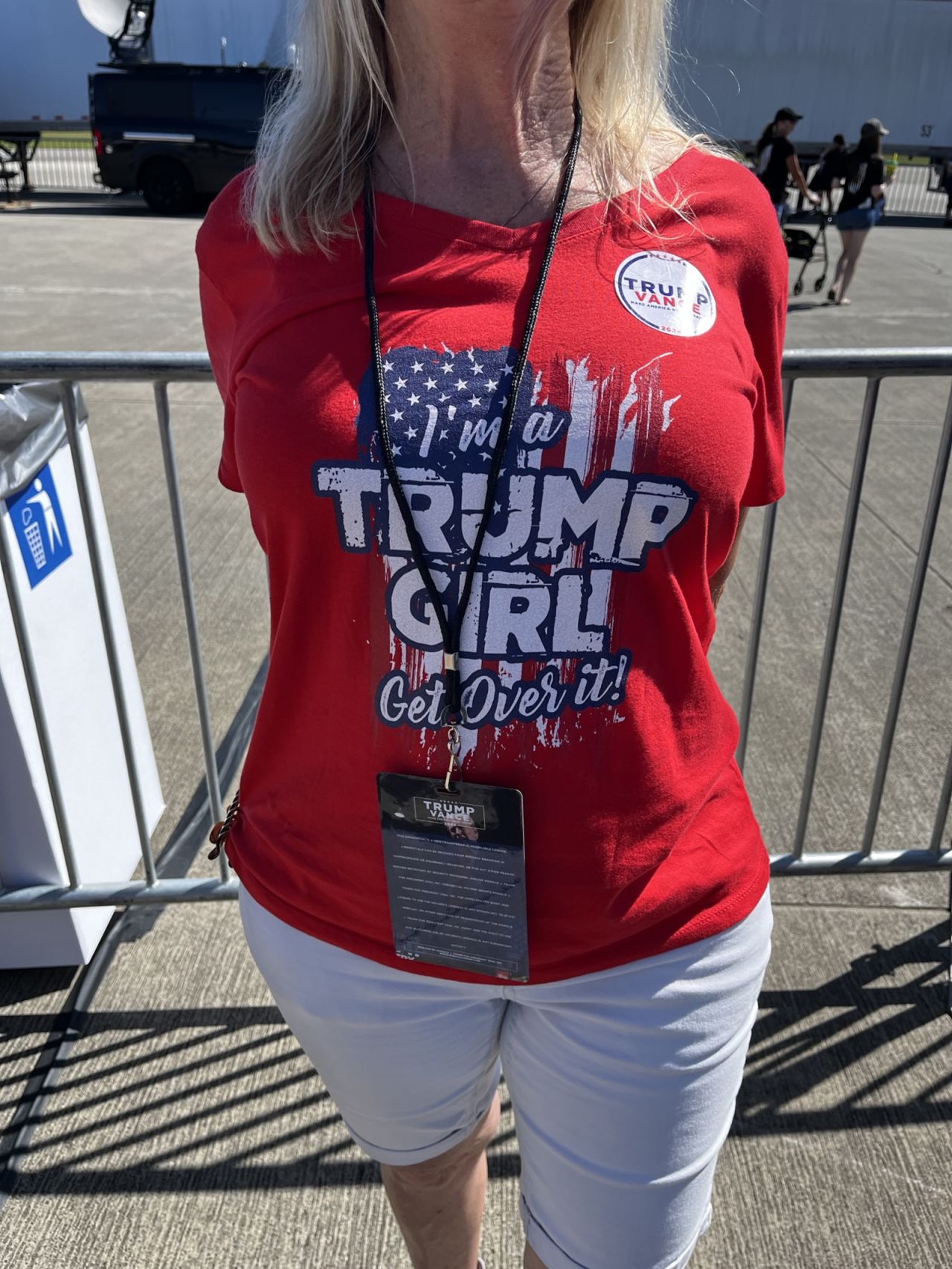 A woman wears an “I’m a Trump Girl, Get Over It!” T-shirt ahead of former President Donald Trump’s rally in Wilmington, North Carolina, on September 21.