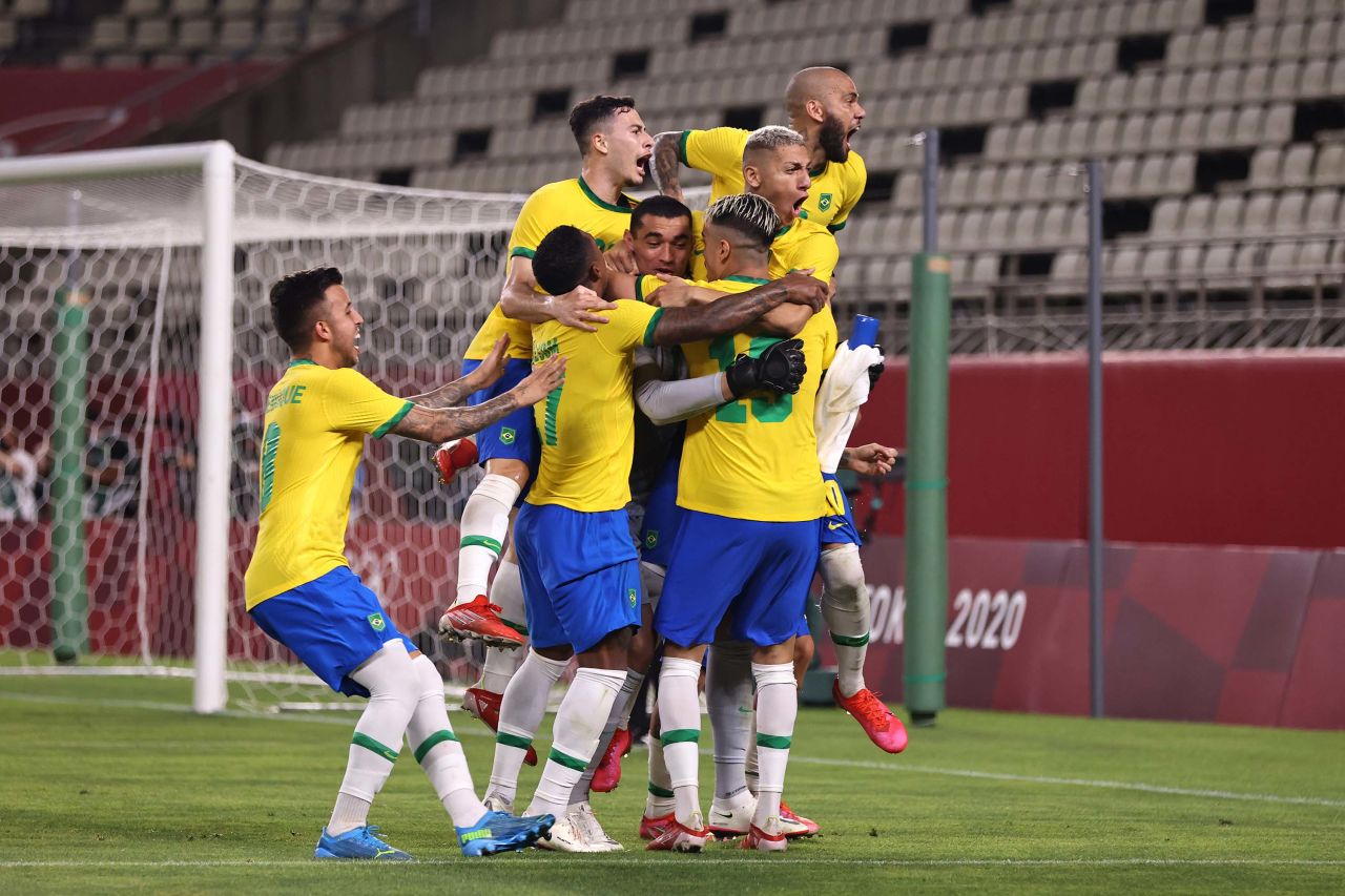 Members of Team Brazil celebrate during a penalty shoot out in the men's football semi-final match between Mexico and Brazil, on August 3 in Kashima, Japan.