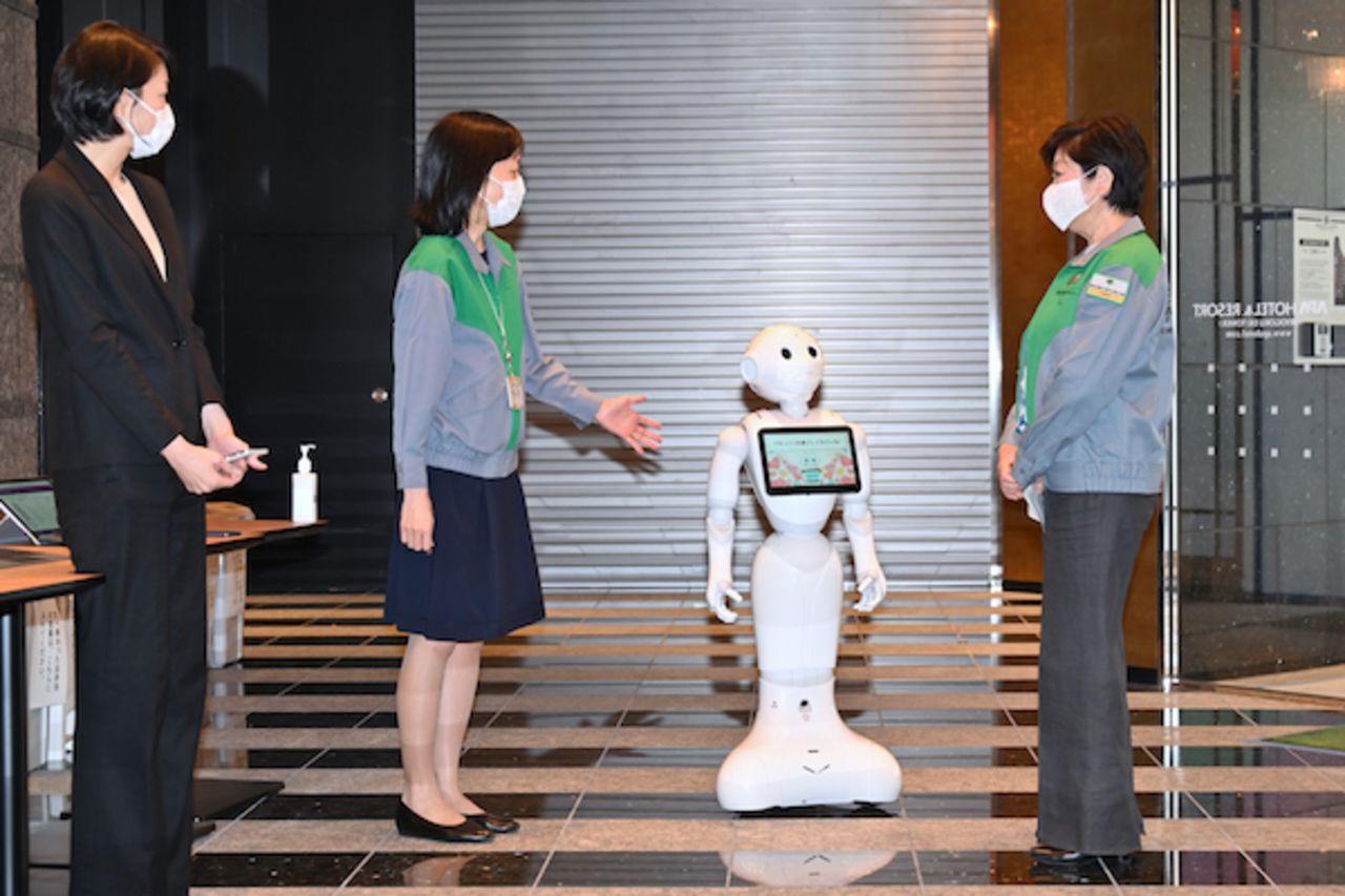 Tokyo governor Yuriko Koike visits a hotel where the robots are stationed.