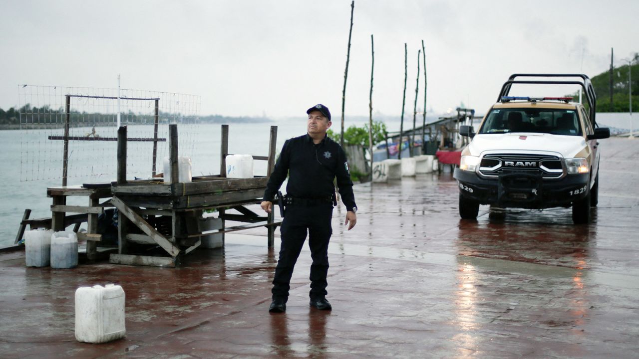 A local police officer checks the Miramar beach before the arrival of Tropical Storm Alberto in Tampico, Tamaulipas State, Mexico, on June 19.