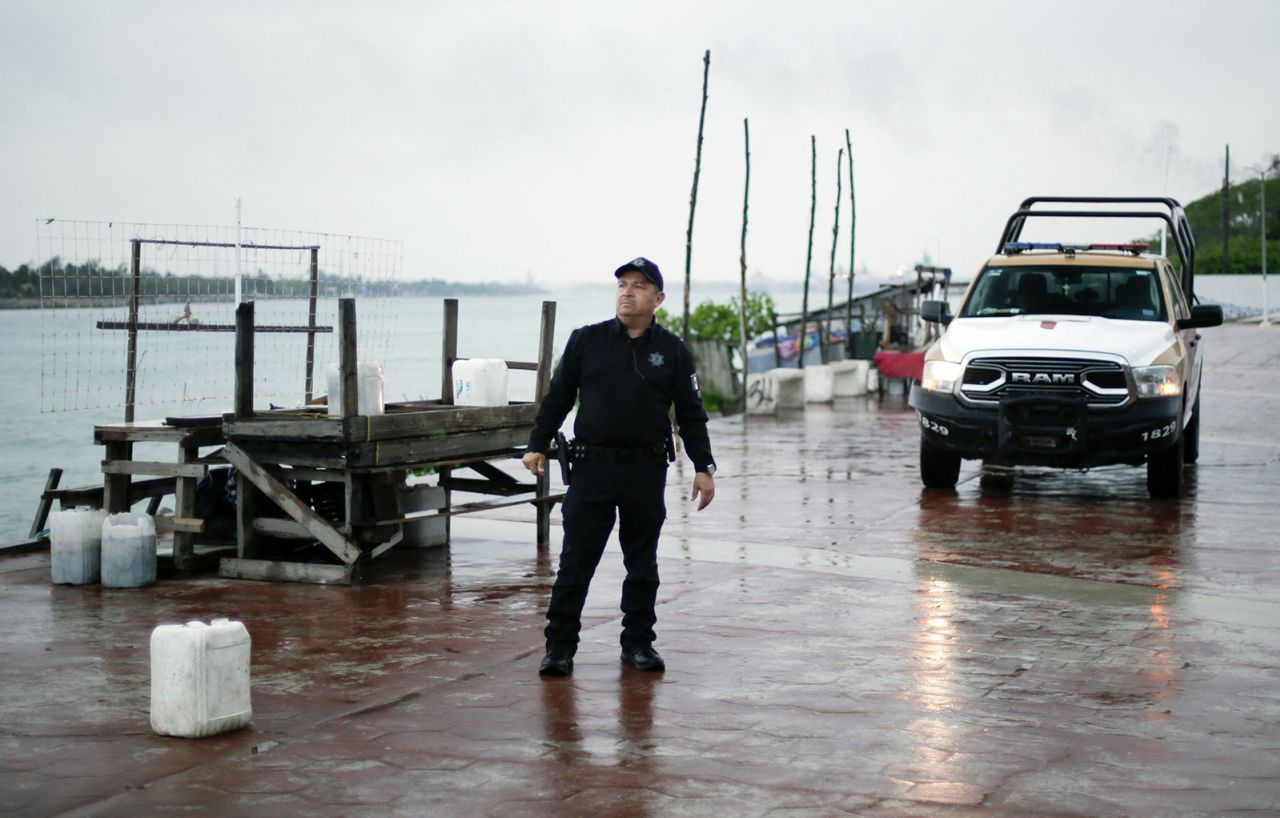 A local police officer checks the Miramar beach before the arrival of Tropical Storm Alberto in Tampico, Tamaulipas State, Mexico, on June 19.