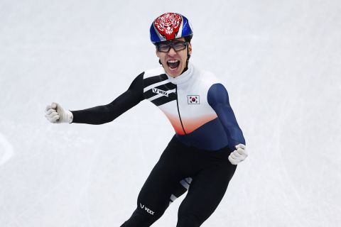 South Korean speed skater Hwang Dae-heon celebrates winning the gold medal in the men's 1,500m short track event.