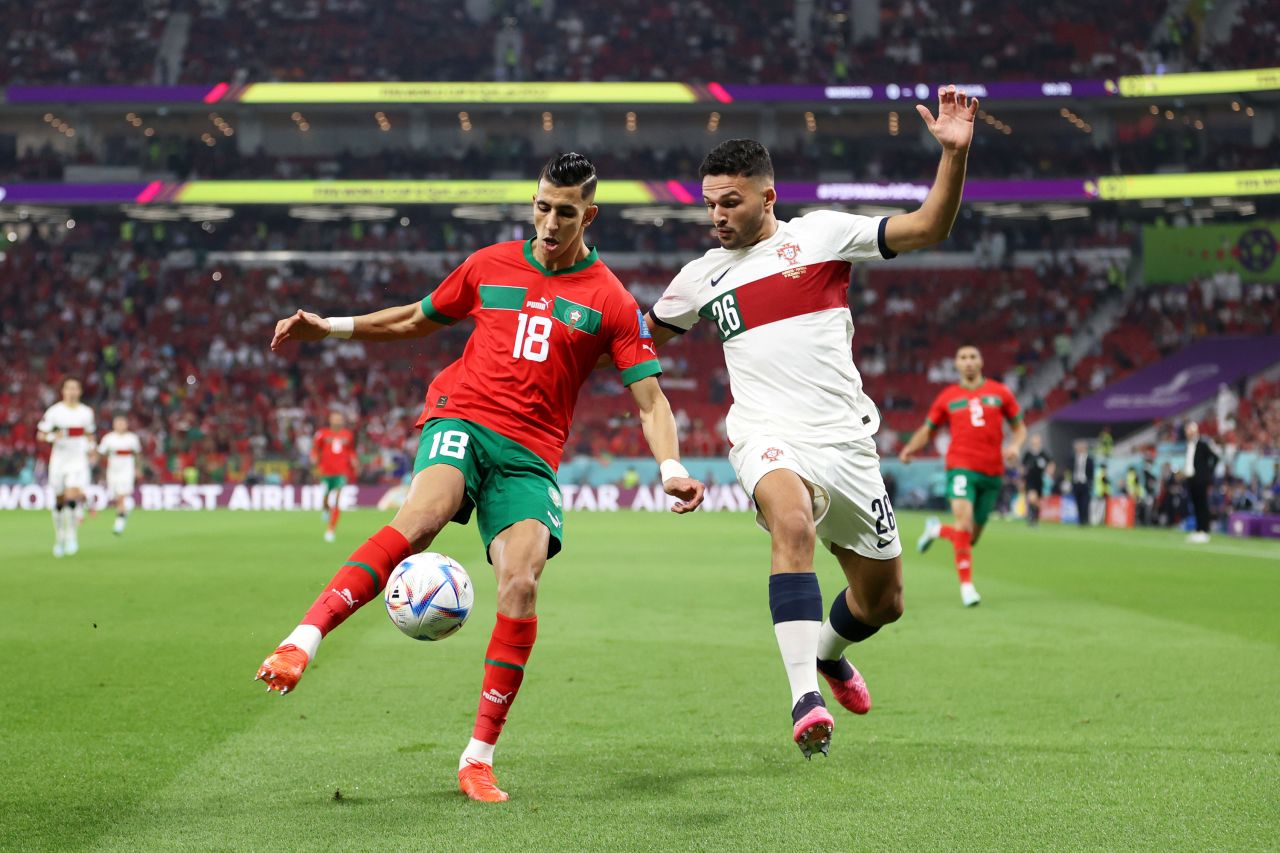 Morocco’s Jawad El Yamiq, left, battles for possession with Portugal’s Goncalo Ramos on Saturday. 