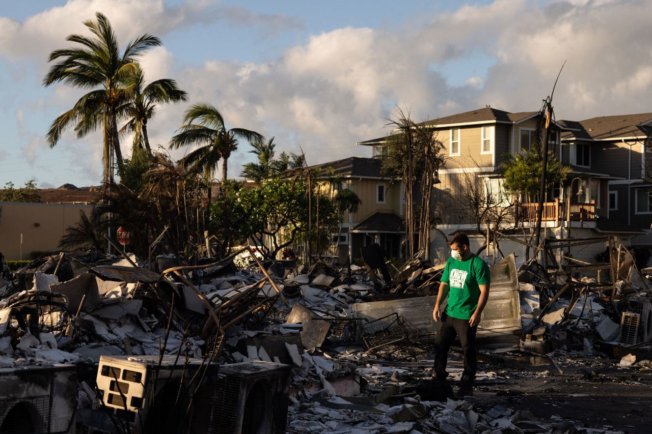 ?A Mercy Worldwide volunteer assesses the damage to an apartment complex in Lahaina, Hawaii, on Saturday. 