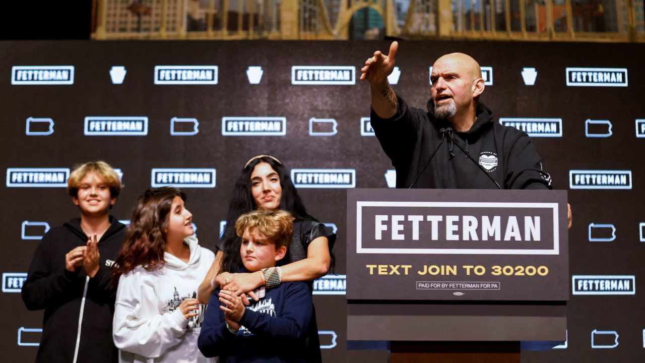 Fetterman is joined by his wife, Gisele, and their children as he addresses supporters.