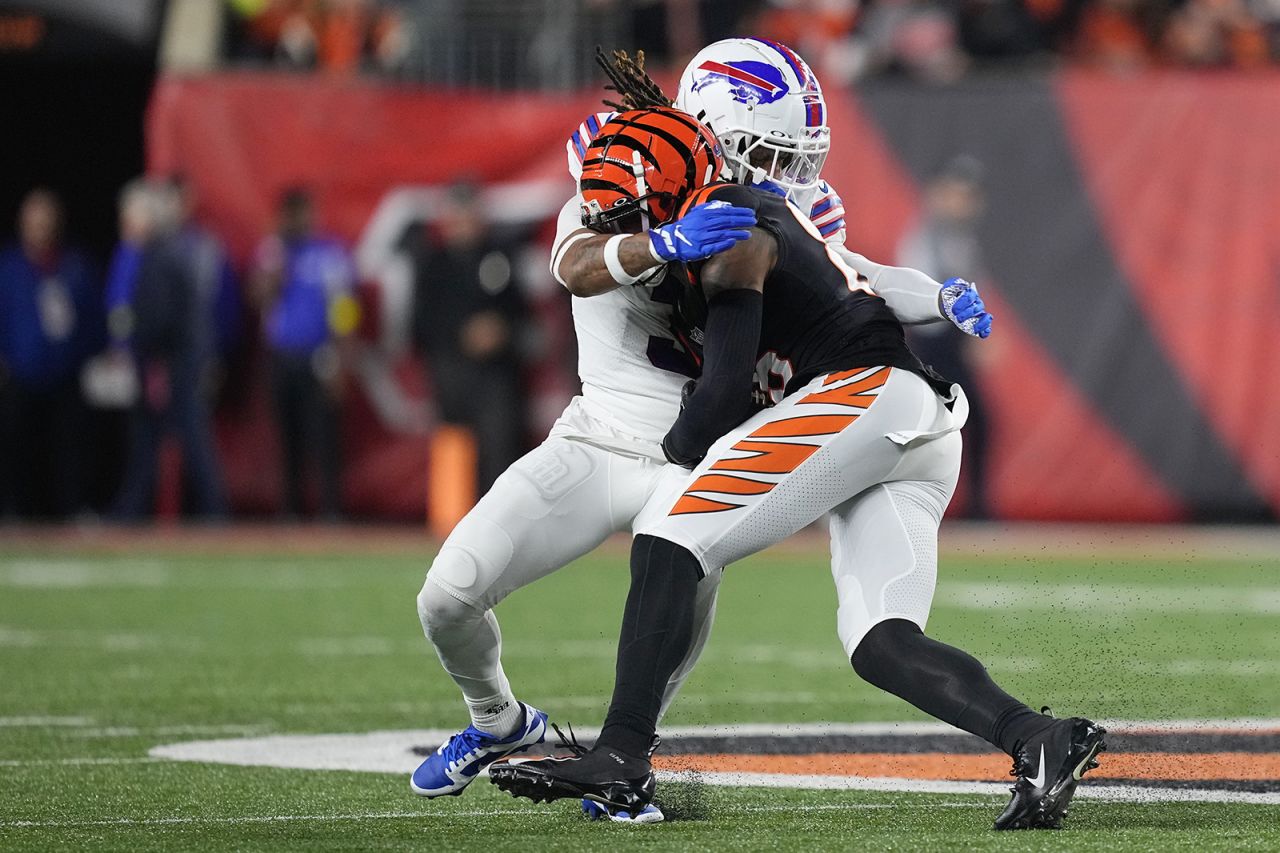 Damar Hamlin #3 of the Buffalo Bills tackles Tee Higgins #85 of the Cincinnati Bengals.