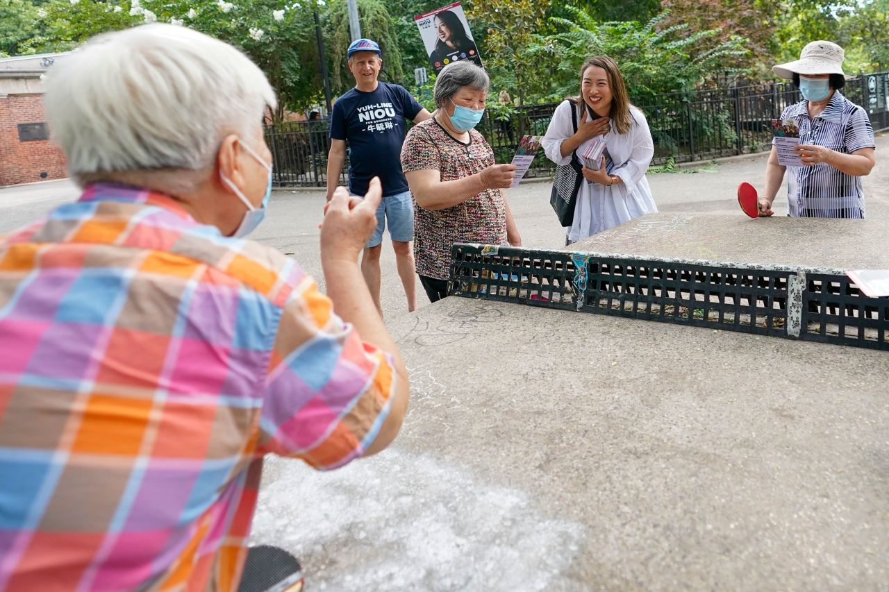 New York State Assemblywoman Yuh-Line Niou, second from right, talks to voters while campaigning in Tompkins Square Park in New York on August 21.