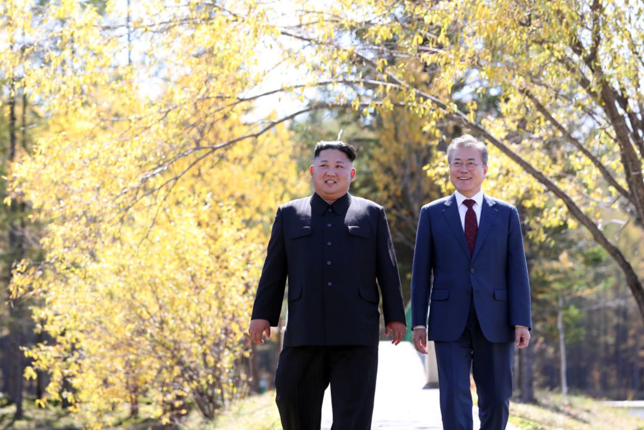 North Korean leader Kim Jong Un and South Korean President Moon Jae-in walk together in September 2018.