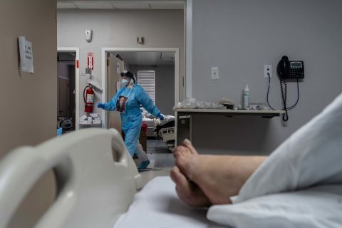 A medical staff member walks in the Covid-19 intensive care unit (ICU) at the United Memorial Medical Center (UMMC) on November 10, in Houston, Texas. 