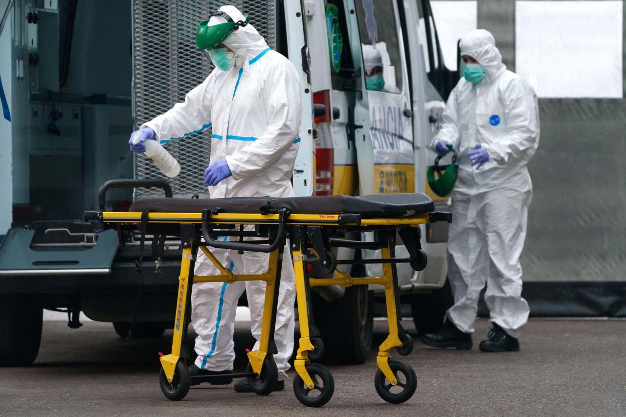 Paramedics disinfect a stretcher outside the Burgos Hospital in northern Spain on April 2.