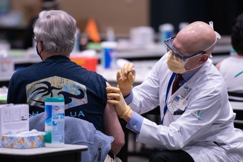 Chief clinical officer John Corman MD at Virginia Mason administers a dose of the Pfizer Covid-19 vaccine at the Amazon Meeting Center in downtown Seattle, Washington on January 24.