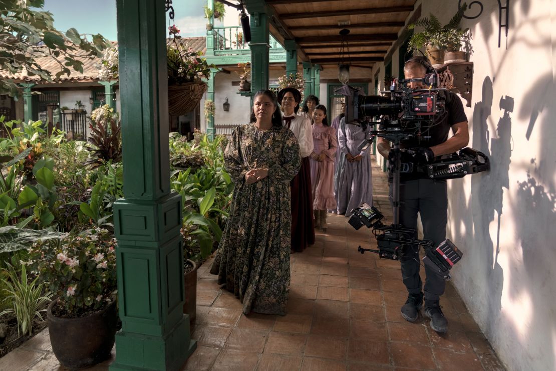 Behind the scenes with Marleyda Soto, as Úrsula Iguarán in her latter years, Jacqueline Arenal as Leonor Moscote and Cristal Aparicio as Remedios Mosco. Costuming involved painstaking research as well as creative liberties, imagining how dress would have changed as Macondo becomes increasingly connected to the outside world.