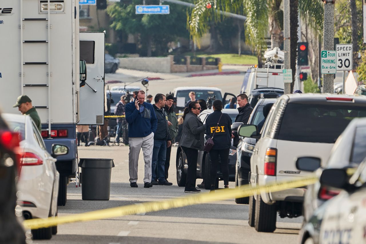 FBI investigators stand near the Star Dance Studio in Monterey Park, California on January 22.