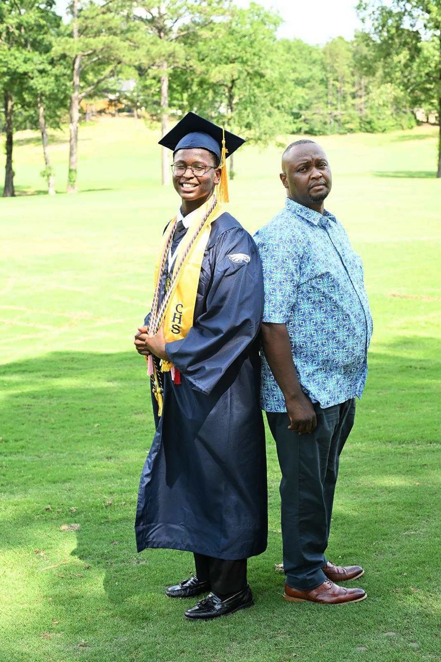 Byron Barua graduated on May 20 without his grandfather in attendance. At right is his father, Willington Barua.