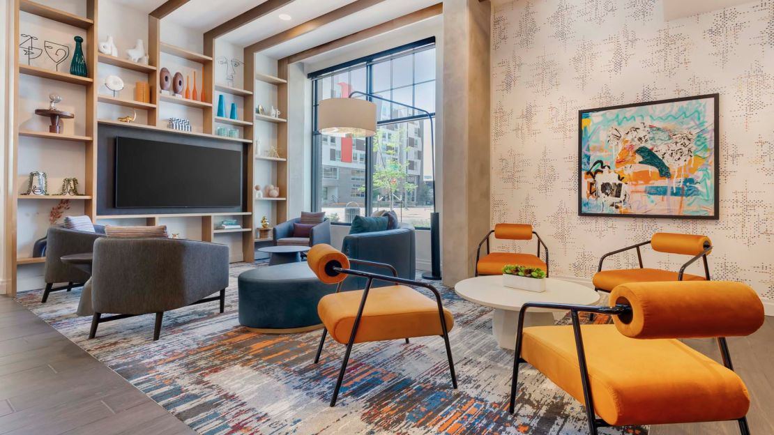 A photo of a seating area in the lobby of the Cambria Hotel Denver Downtown RiNo