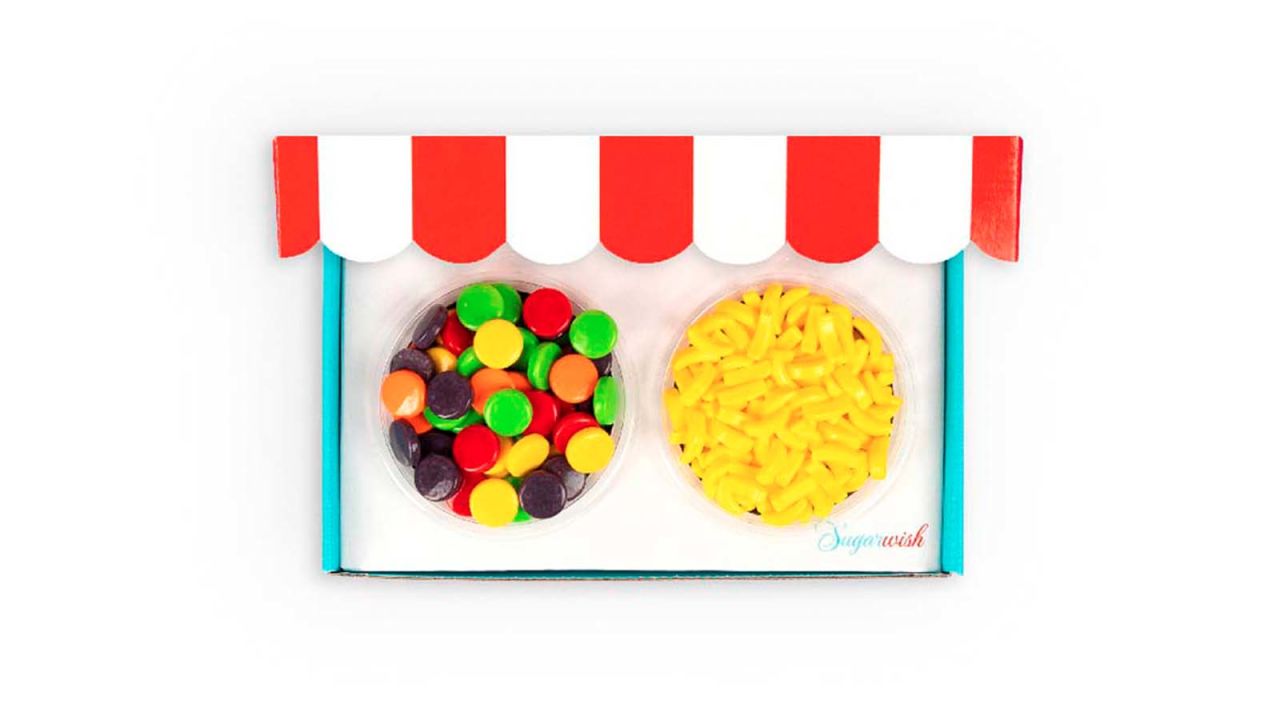 Two bowls of candy in a red, white and blue cardboard box.