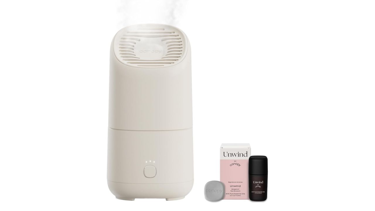 Canopy portable humidifier next to some accessories against a white background