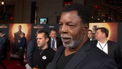 Carl Weathers talks to a reporter at "The Mandelorian" premiere