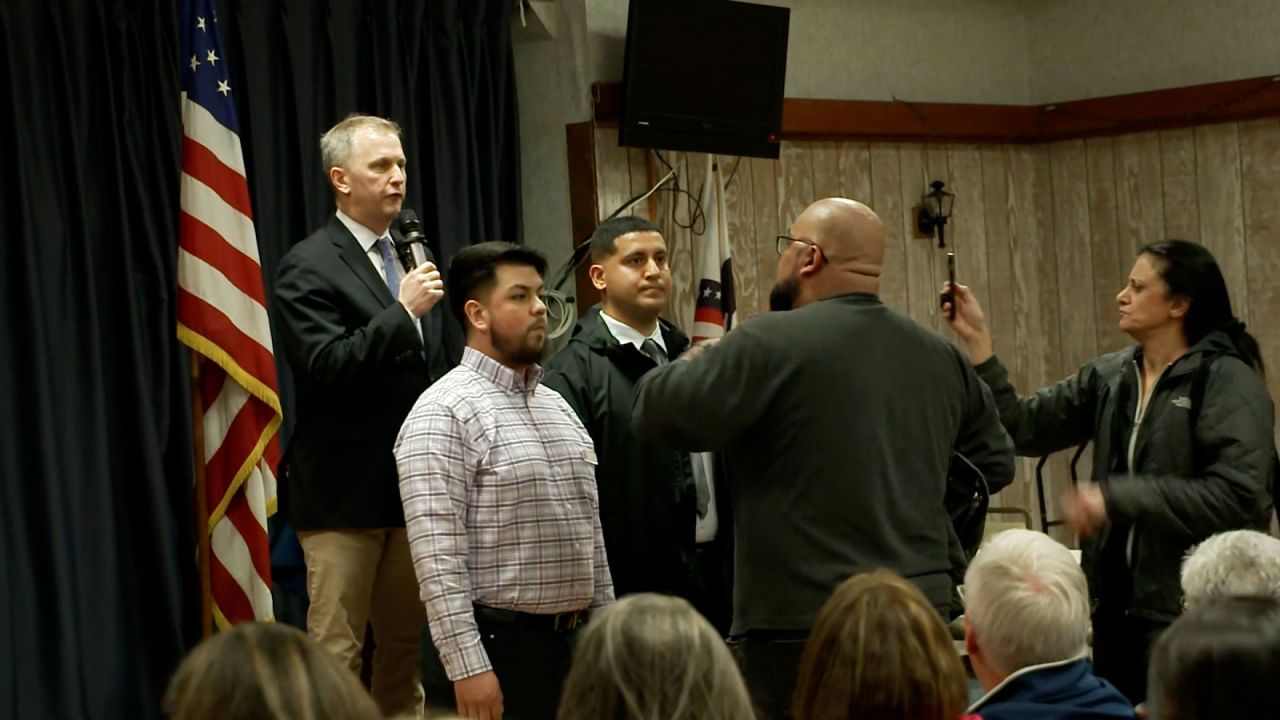 An attendee argues with  Rep Sean Casten during a town hall.