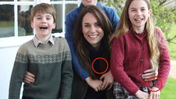 This photo released by Kensington Palace shows Kate, Princess of Wales, with her children, Prince Louis, left, Prince George and Princess Charlotte. The circled areas appear to show evidence of potential manipulation, including Princess Charlotte’s sleeve cuff and a zipper on the lefthand side of the jacket of the Princess of Wales, which does not appear to be aligned.