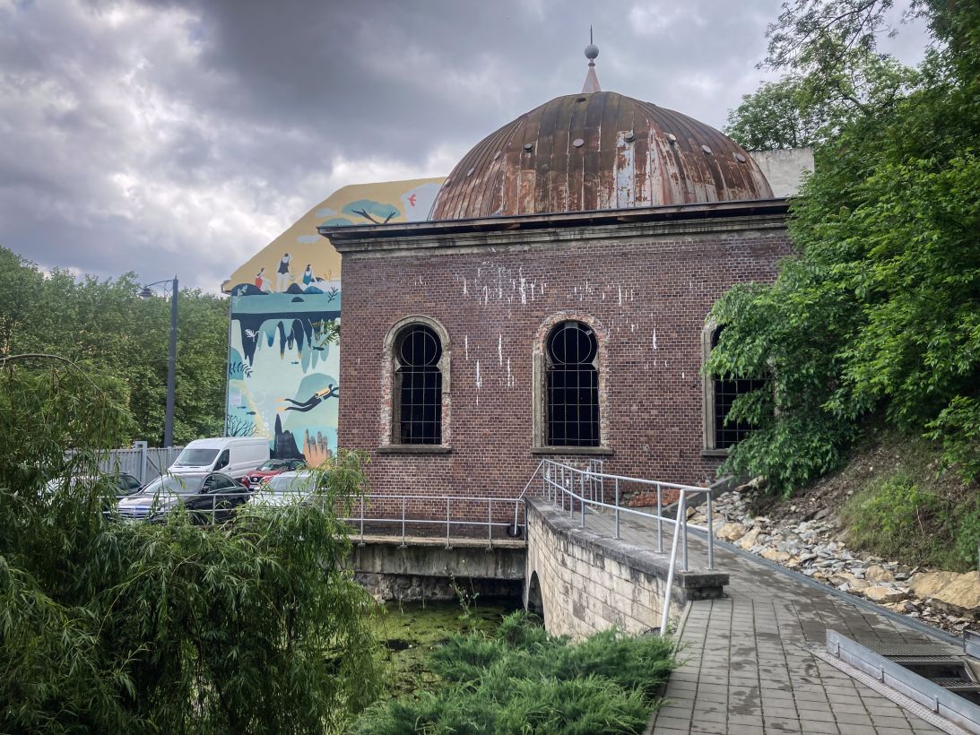 The entrance to the cave system is easy to miss, tucked away next to a crumbling 19th-century bathhouse.