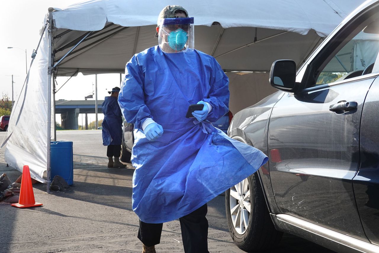 Members of the Wisconsin National Guard test residents for the coronavirus at a temporary test facility in Milwaukee on October 9.