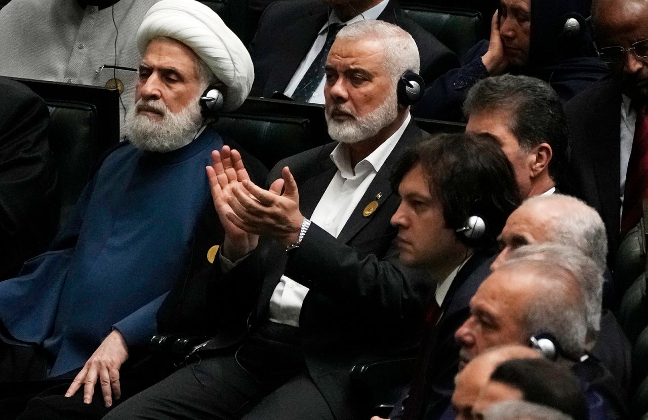 Hamas chief Ismail Haniyeh claps as newly-elected Iranian President Masoud Pezeshkian speaks at the Iranian parliament, in Tehran, Iran, on July 30.