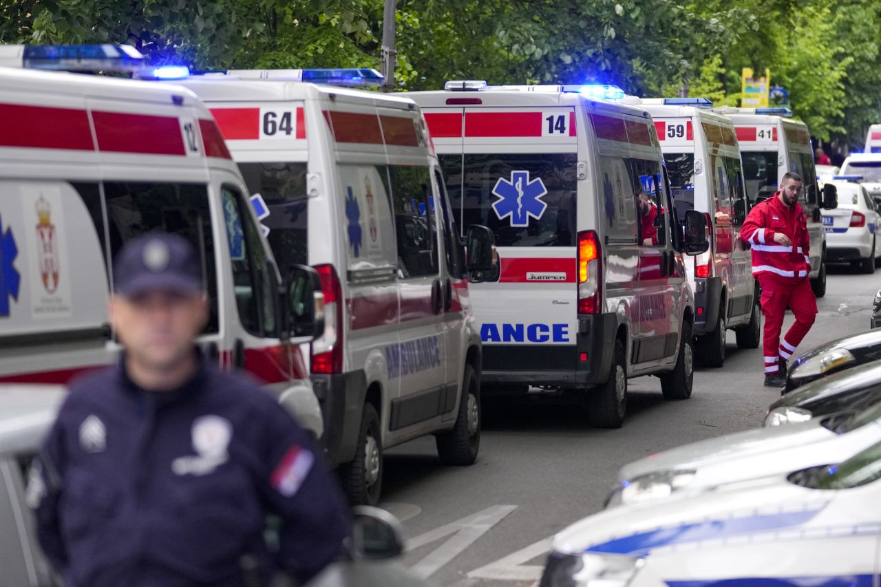 Ambulances line up near the Vladislav Ribnikar school in Belgrade on Wednesday.