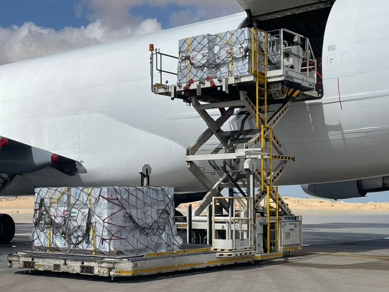 A plane carrying World Health Organization medical supplies unloads at Al Arish airport, Egypt, on October 20.